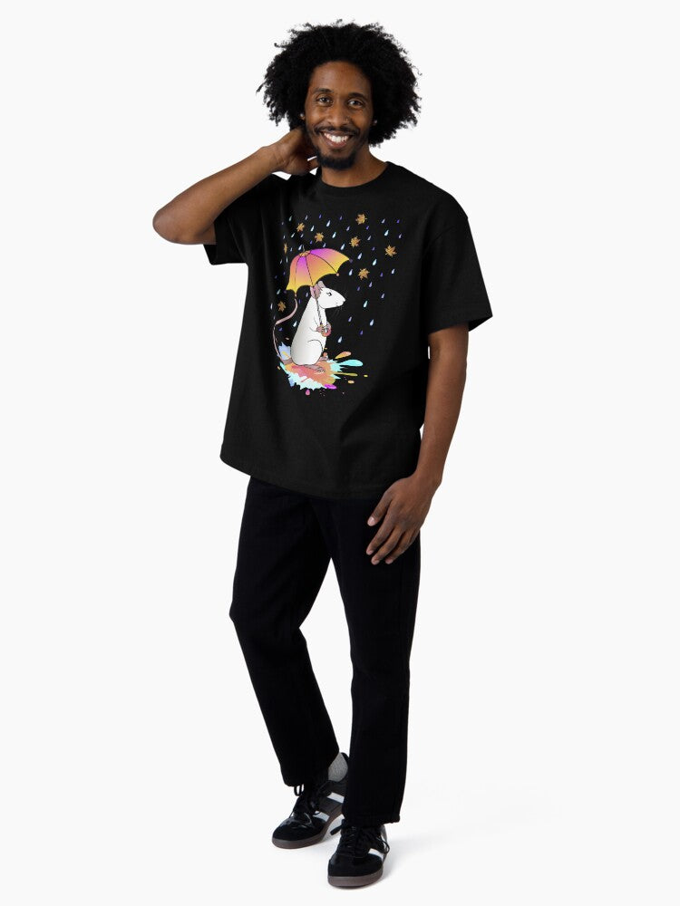 A white decorative rat with an umbrella walks through puddles in the rain with autumn leaves. Oversized T-Shirt