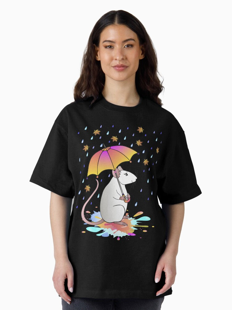 A white decorative rat with an umbrella walks through puddles in the rain with autumn leaves. Oversized T-Shirt