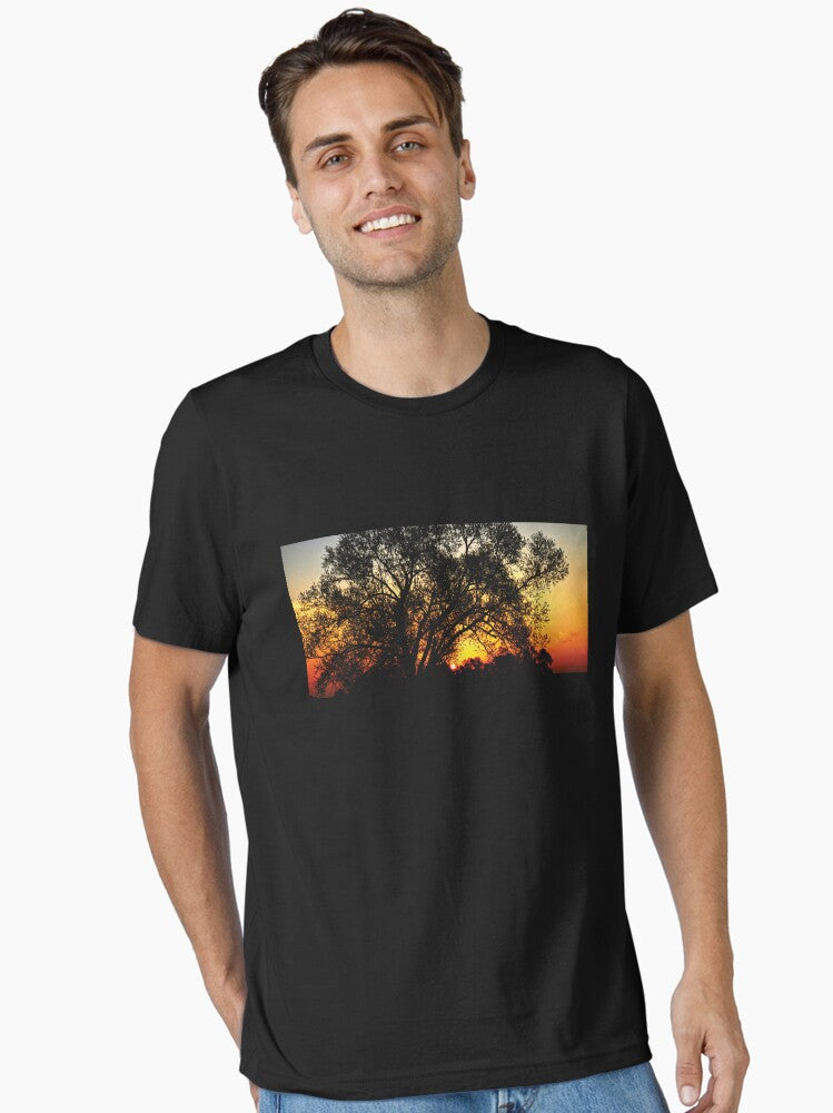 A glory sunrise behind a tree Essential T-Shirt