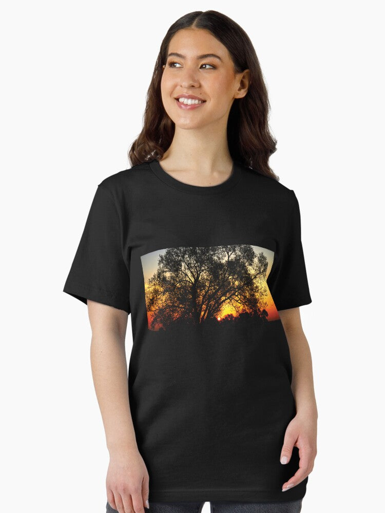 A glory sunrise behind a tree Essential T-Shirt